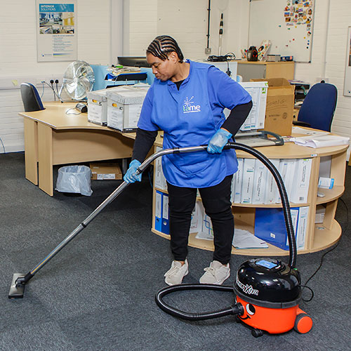 cleaner-vacuuming-an-office-floor